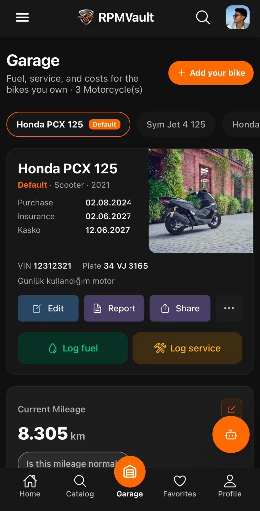 RPMVault motorcycle garage app on a phone, with the bikes you own